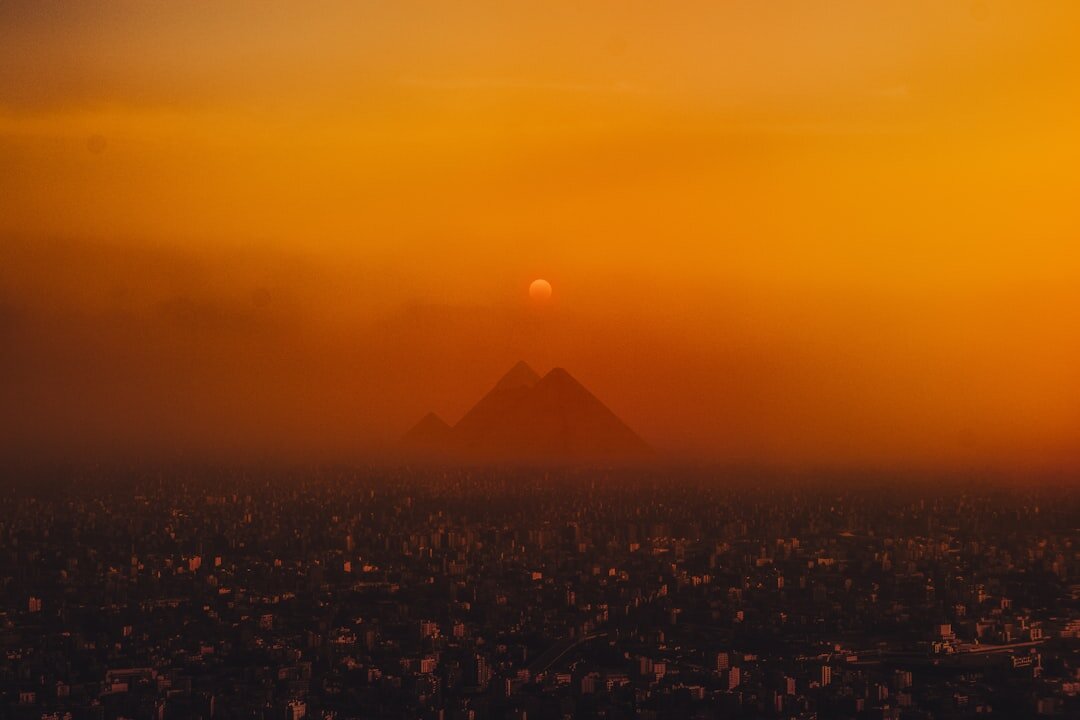 ancient egyptian pyramids at dusk